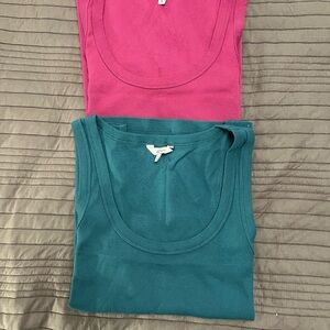 Reitman’s Teal and Pink Tank Tops